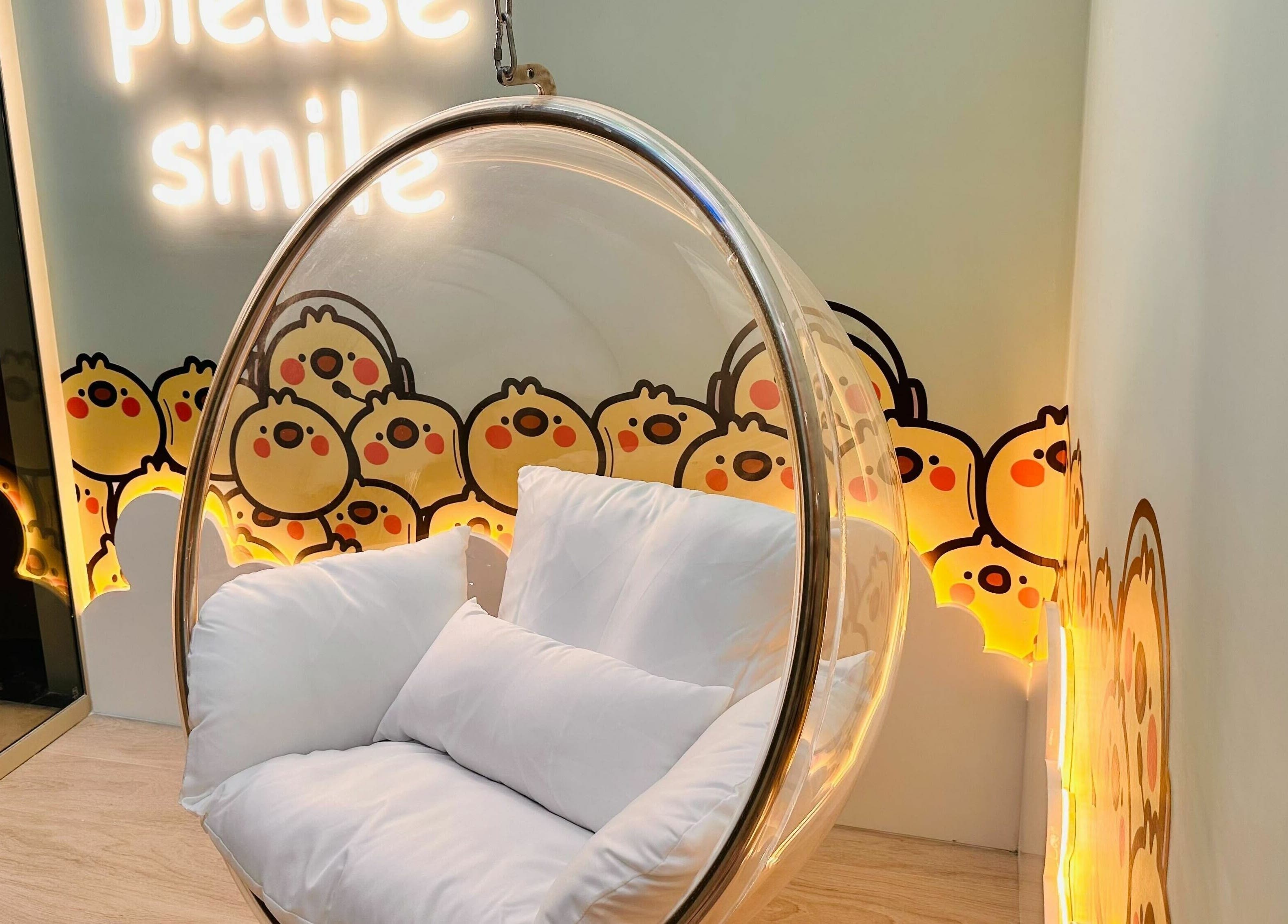 Cozy bubble chair at Little Scissors Kids Salon, Abu Dhabi, Abu Dhabi, AE with fun cartoon decor.