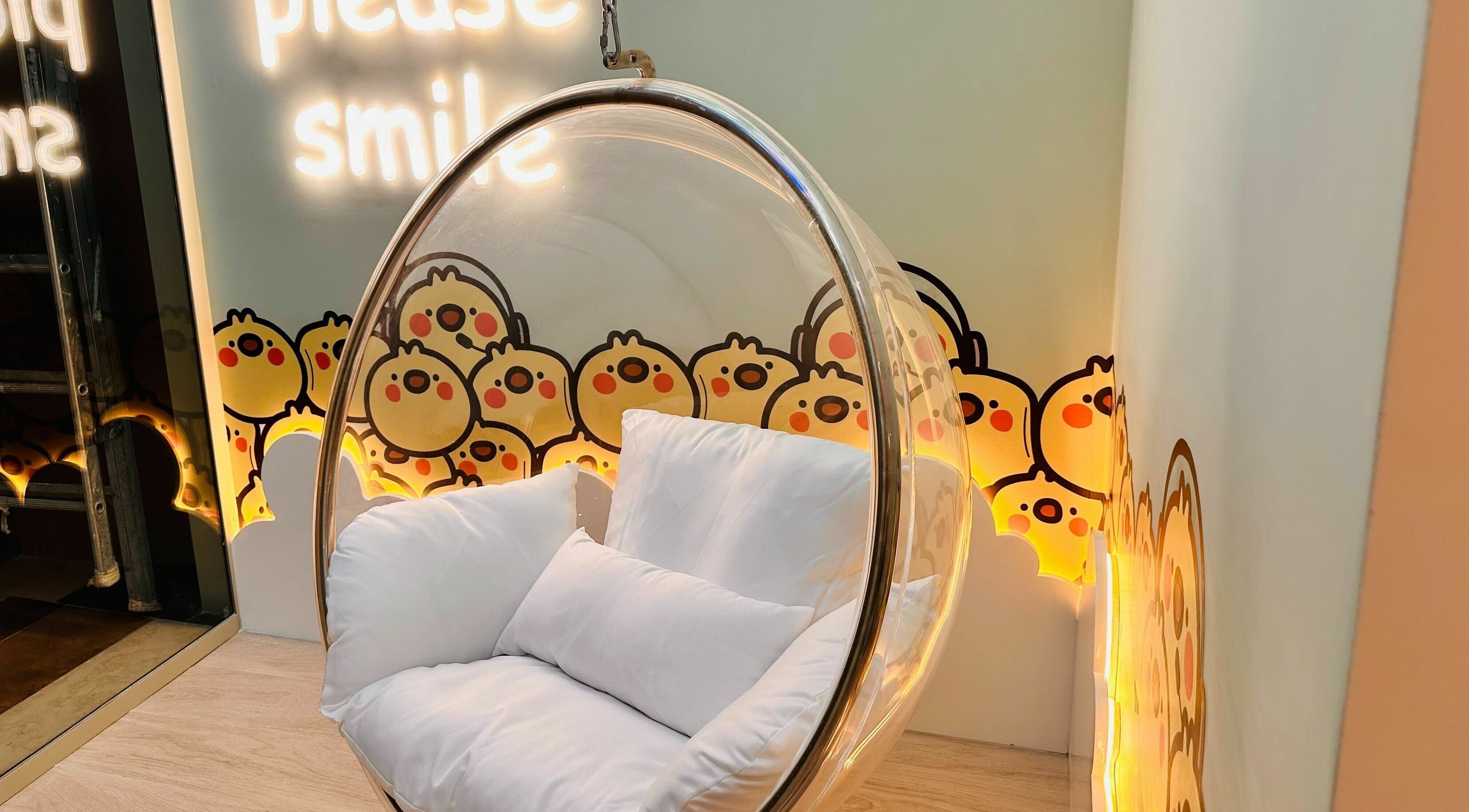 Cozy bubble chair at Little Scissors Kids Salon, Abu Dhabi, Abu Dhabi, AE with fun cartoon decor.