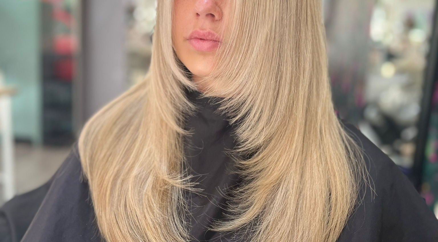 Sleek blonde hair styled at Allanah Watson Hair in Glasgow, Scotland, GB for a chic and polished look.