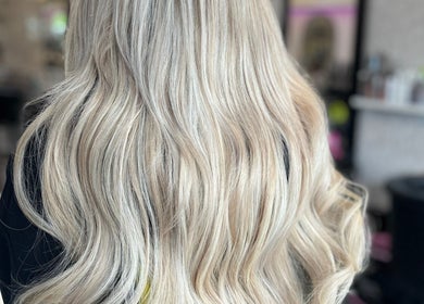 Long, flowing blonde hair styled at Allanah Watson Hair in Glasgow, Scotland, GB.