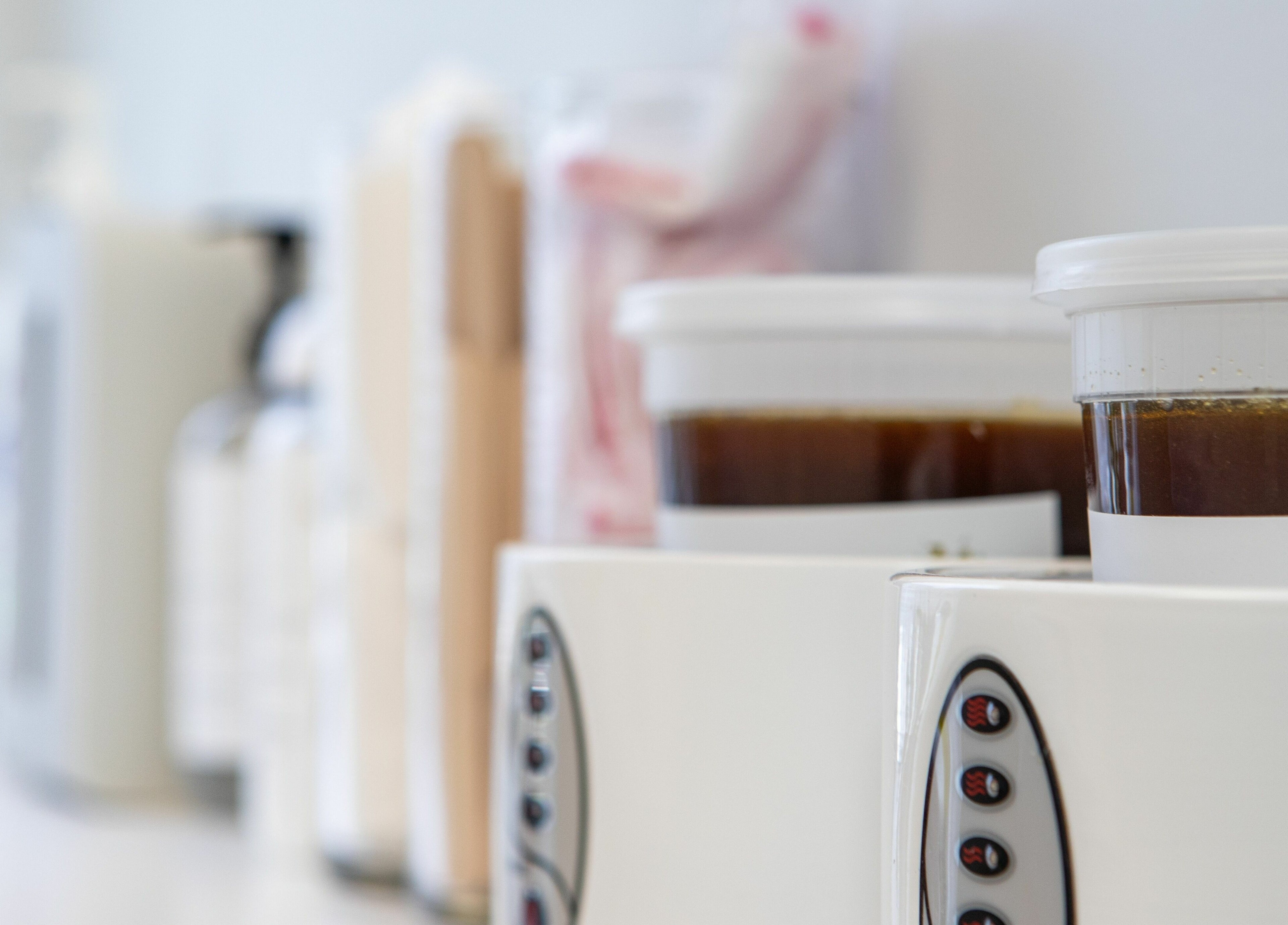 Sugaring supplies at Lovely Sugaring, Toronto, Ontario, CA. Featuring warmers and jars for hair removal.