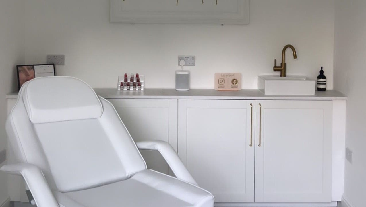 Luxurious treatment room at Elevate Cosmetics, Chippenham, England, GB showcasing plush chair and modern fixtures.