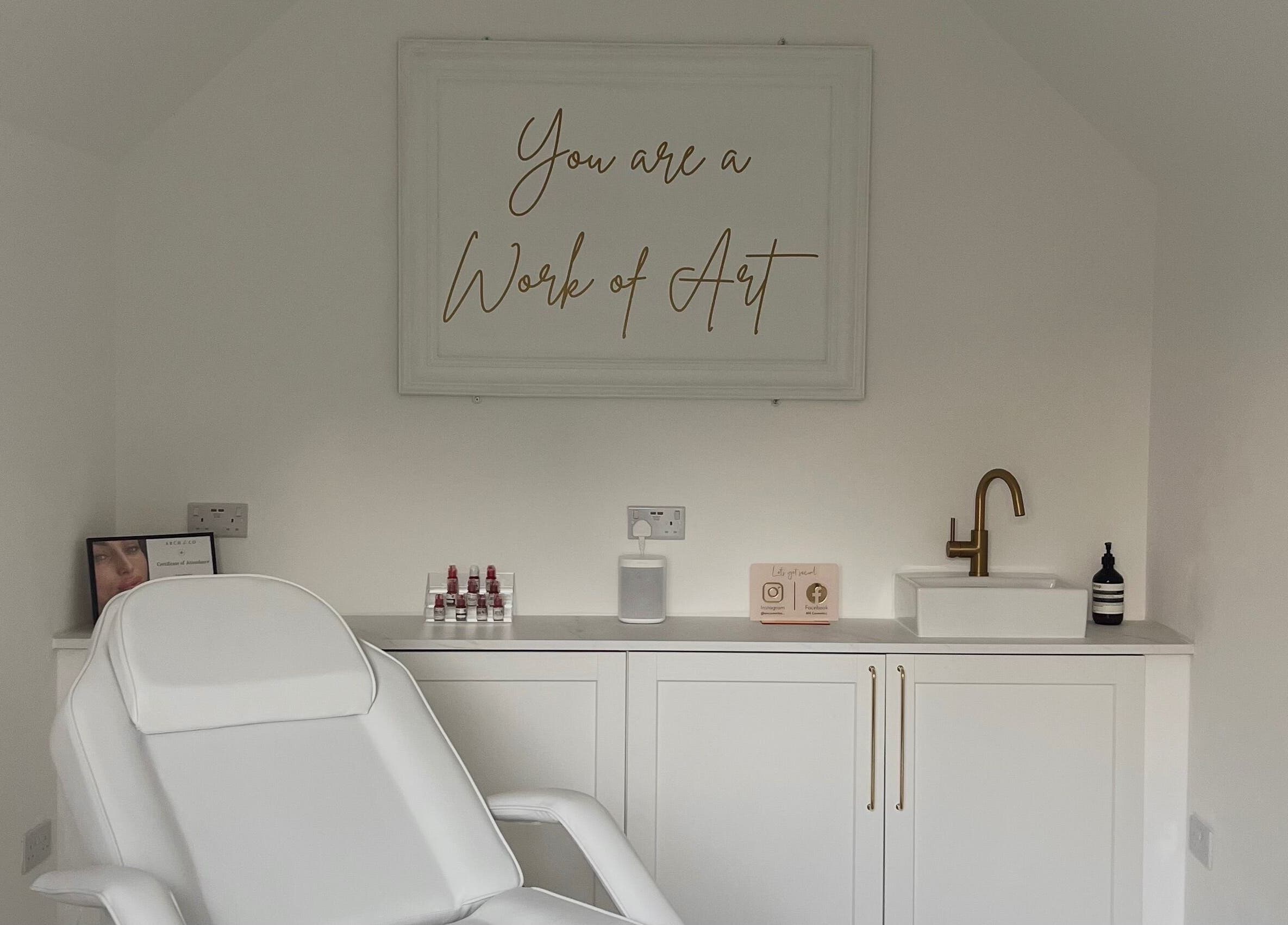 Elevate Cosmetics in Chippenham, England, GB features a serene treatment room with elegant decor and a modern chair.