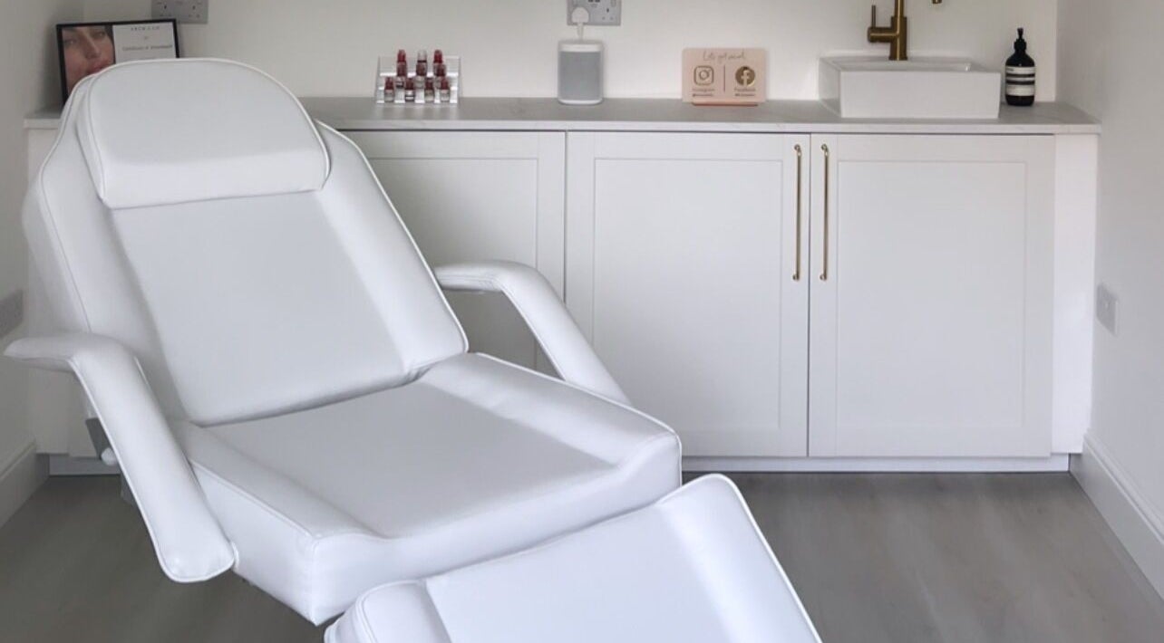 Relaxing treatment room at Elevate Cosmetics, Chippenham, England, GB with a modern chair and clean decor.