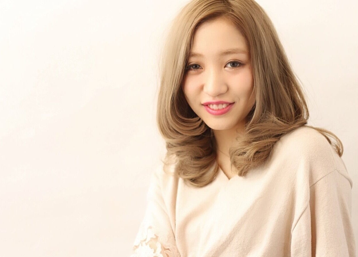 Smiling woman with elegant hairstyle at Art-Noise Japanese Beauty Hair Salon SG, Singapore, Singapore, SG.