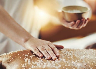 Salt scrub massage at The Healing Spa, Portsmouth, England, GB, enhancing relaxation and skin rejuvenation.