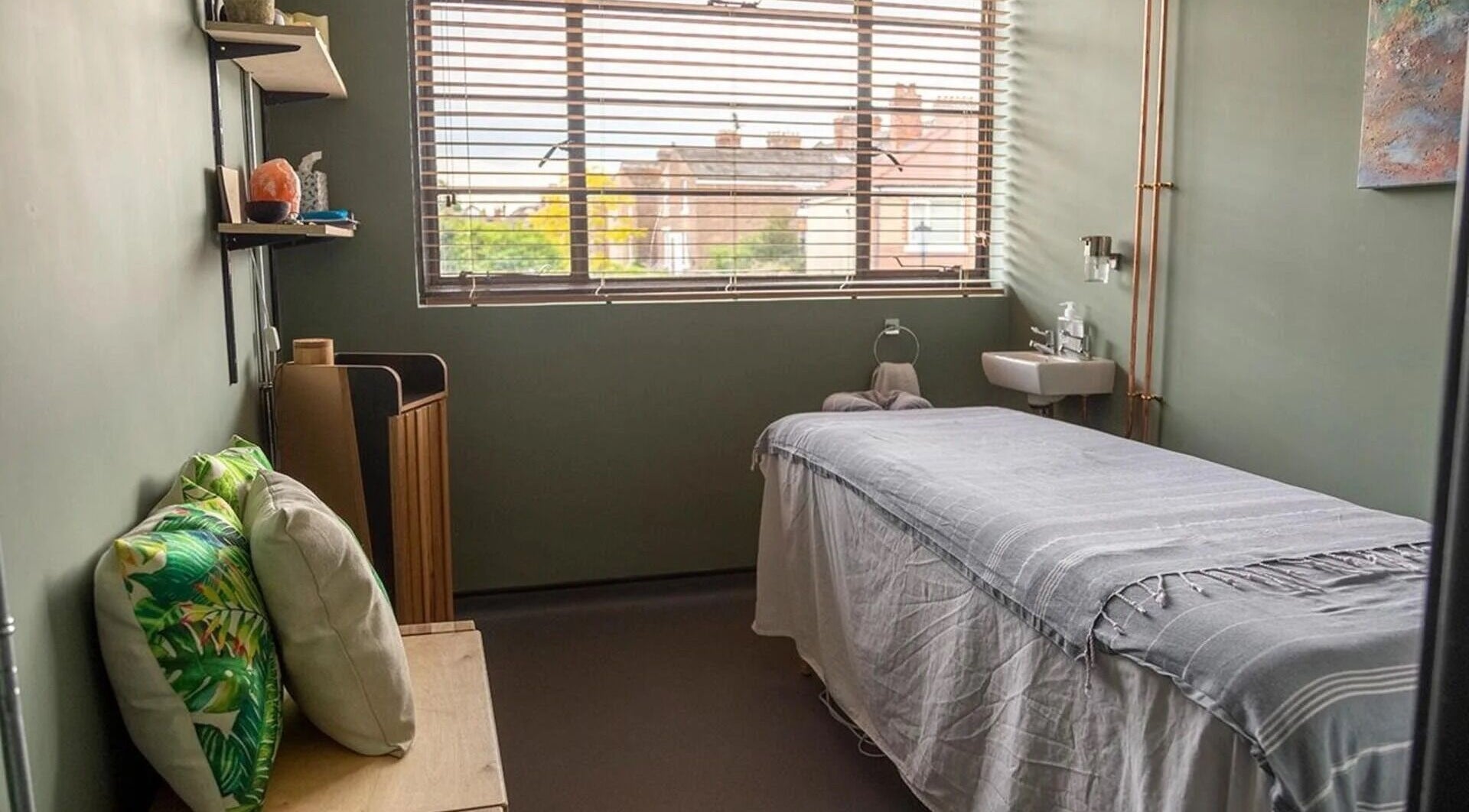 Calming spa room at The Healing Spa, Portsmouth, England, GB with a massage table and tranquil decor.