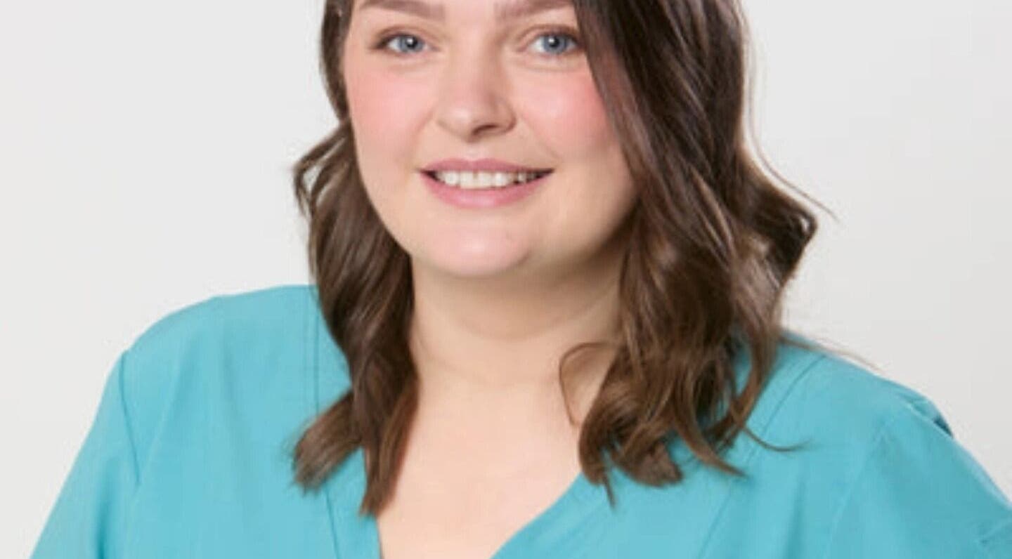 Professional at Teresa Boland Trichology, Ballina, Connacht, IE, in a teal shirt, offering a warm welcome.