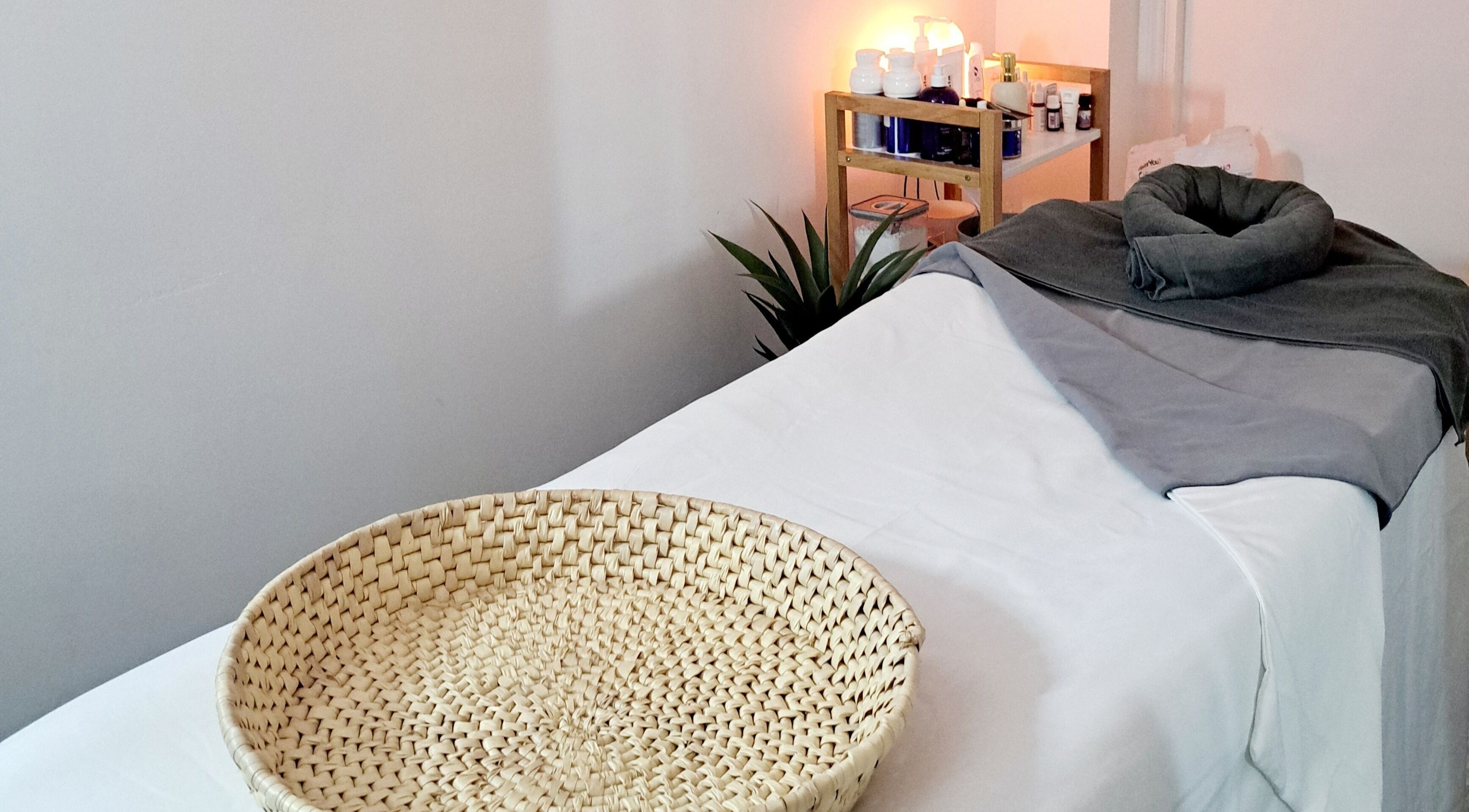 Relaxing treatment room at My Face Spa, London, England, GB, featuring a tidy bed and ambient lighting.