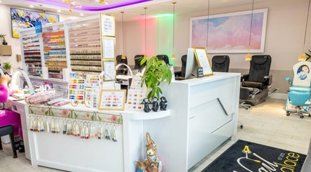 The Nail Palace in Lowell, Massachusetts, US features a vibrant nail polish display and modern seating.