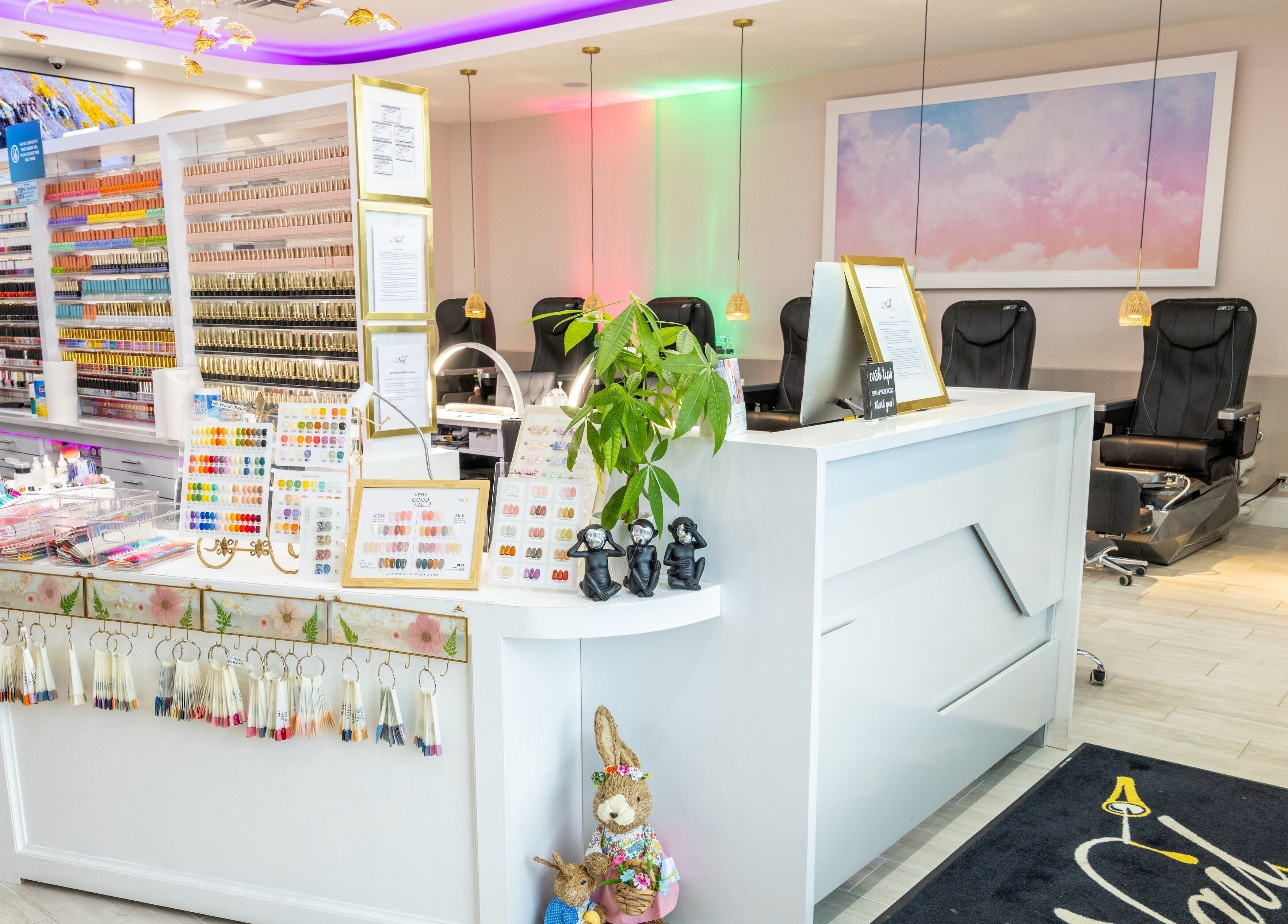 The Nail Palace reception area with colorful nail options in Lowell, Massachusetts, US.
