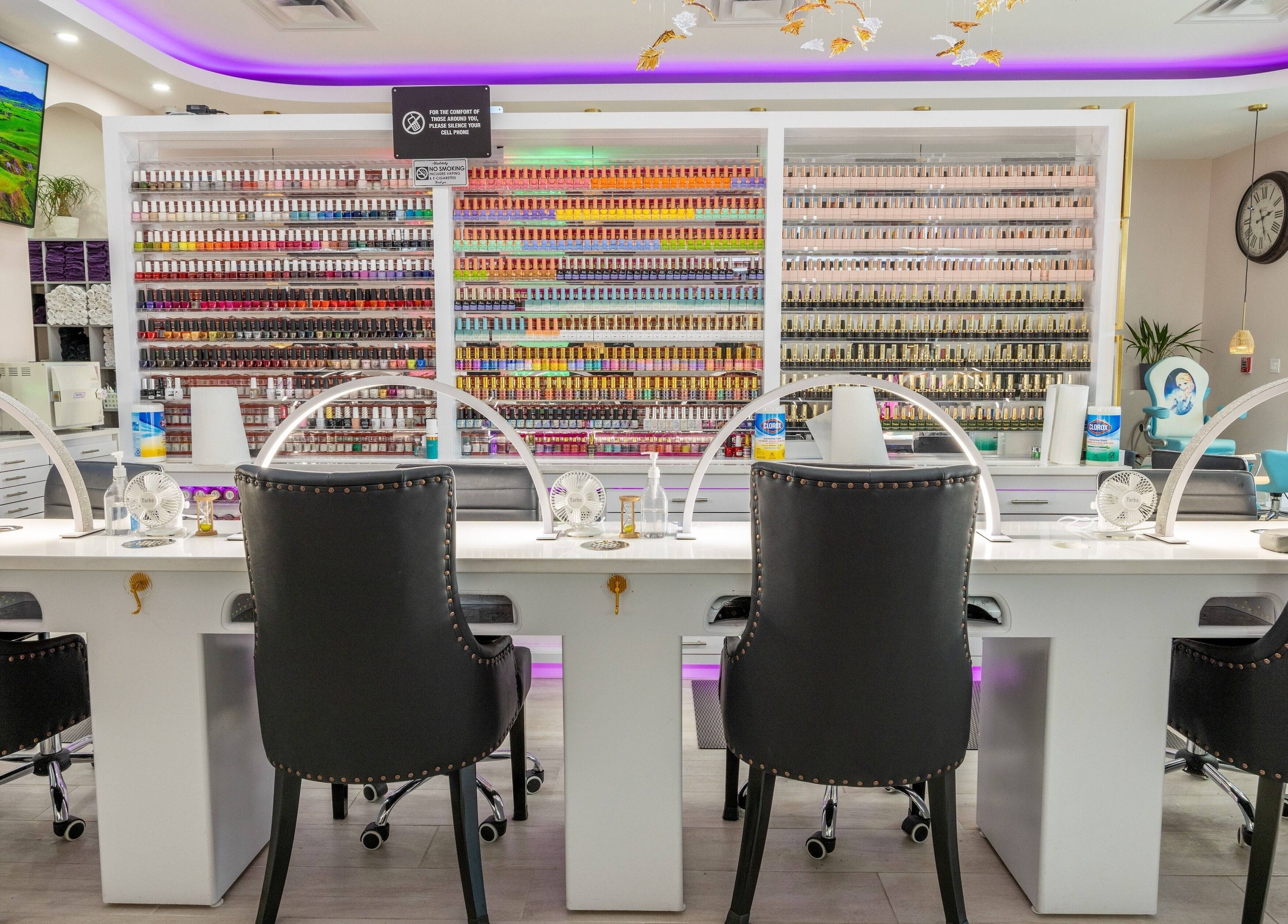 Modern nail salon interior at The Nail Palace, Lowell, Massachusetts, US, showcasing elegant service stations.