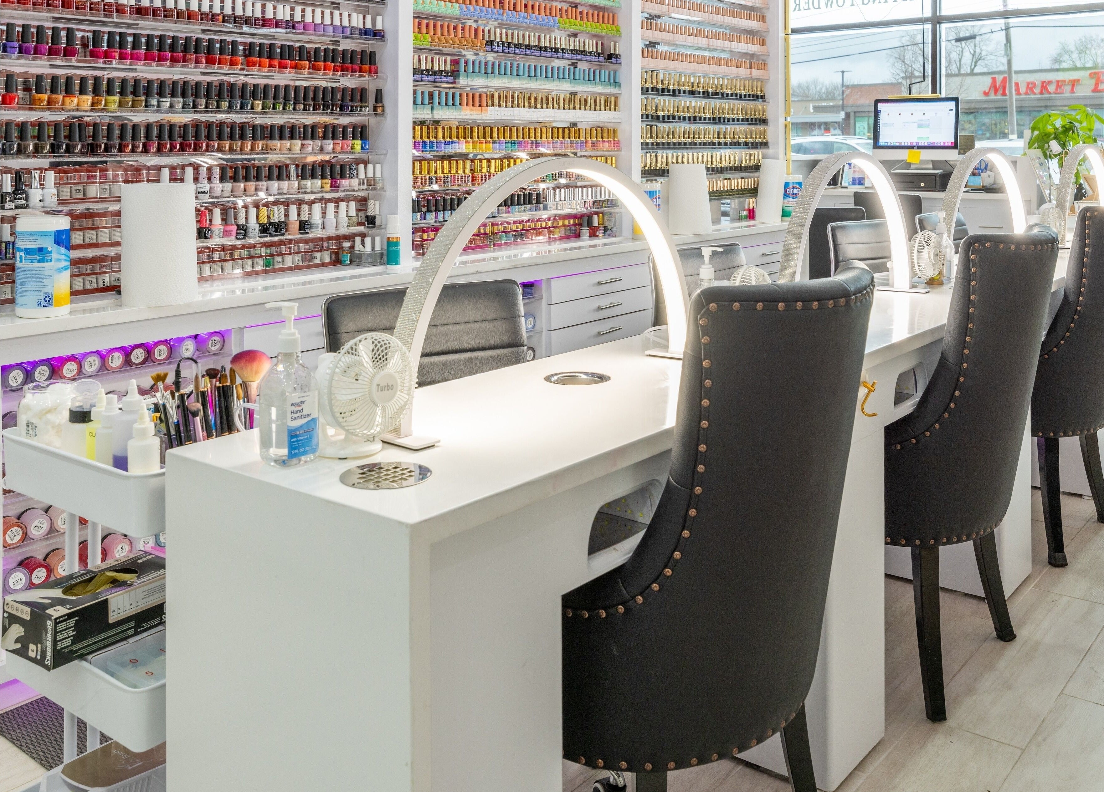 Elegant nail stations at The Nail Palace, Lowell, Massachusetts, US, showcasing a wide color selection.