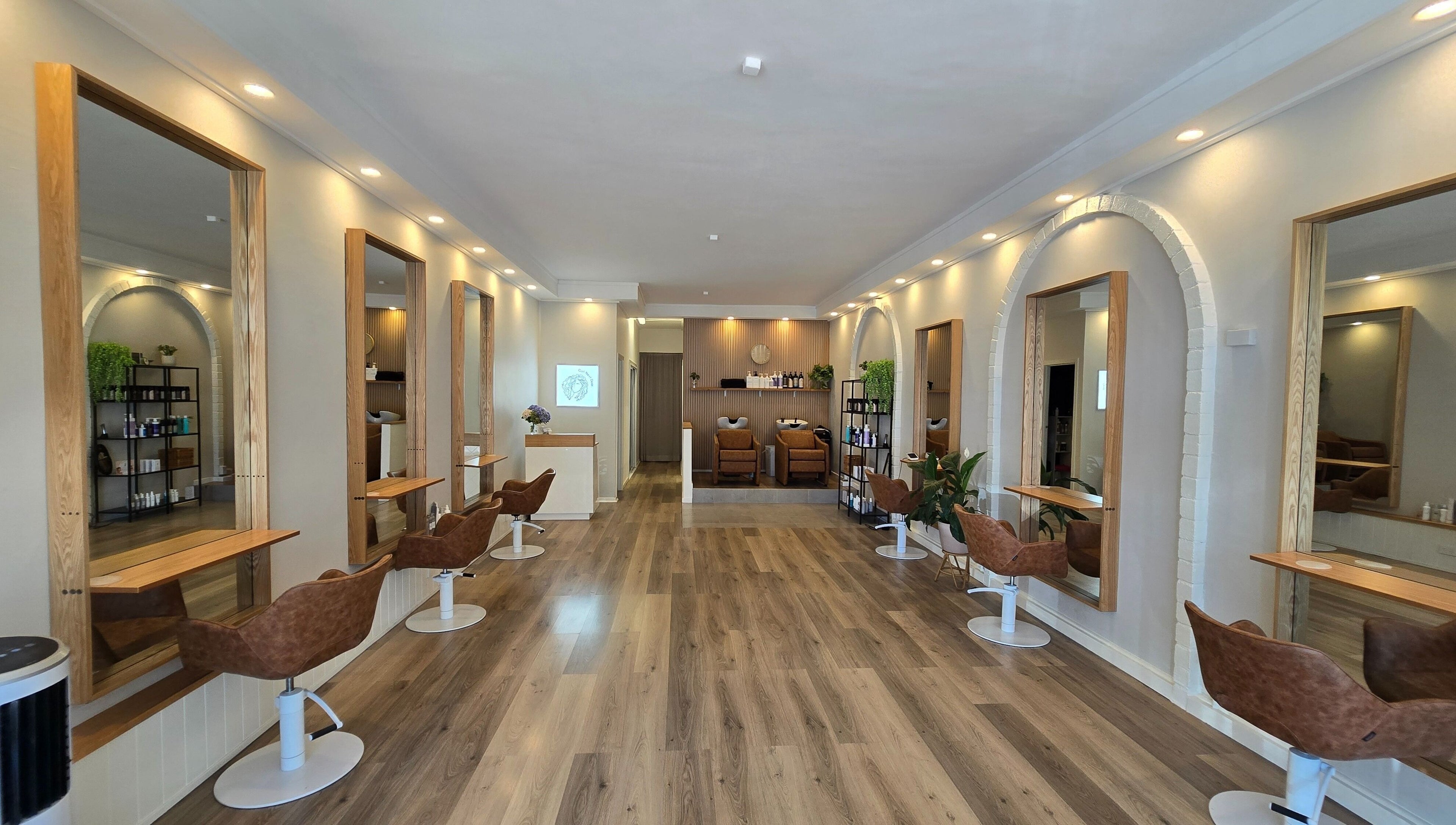 Stylish interior of Lokk Mechanic salon in Melbourne, Victoria, AU with modern chairs and mirrors.