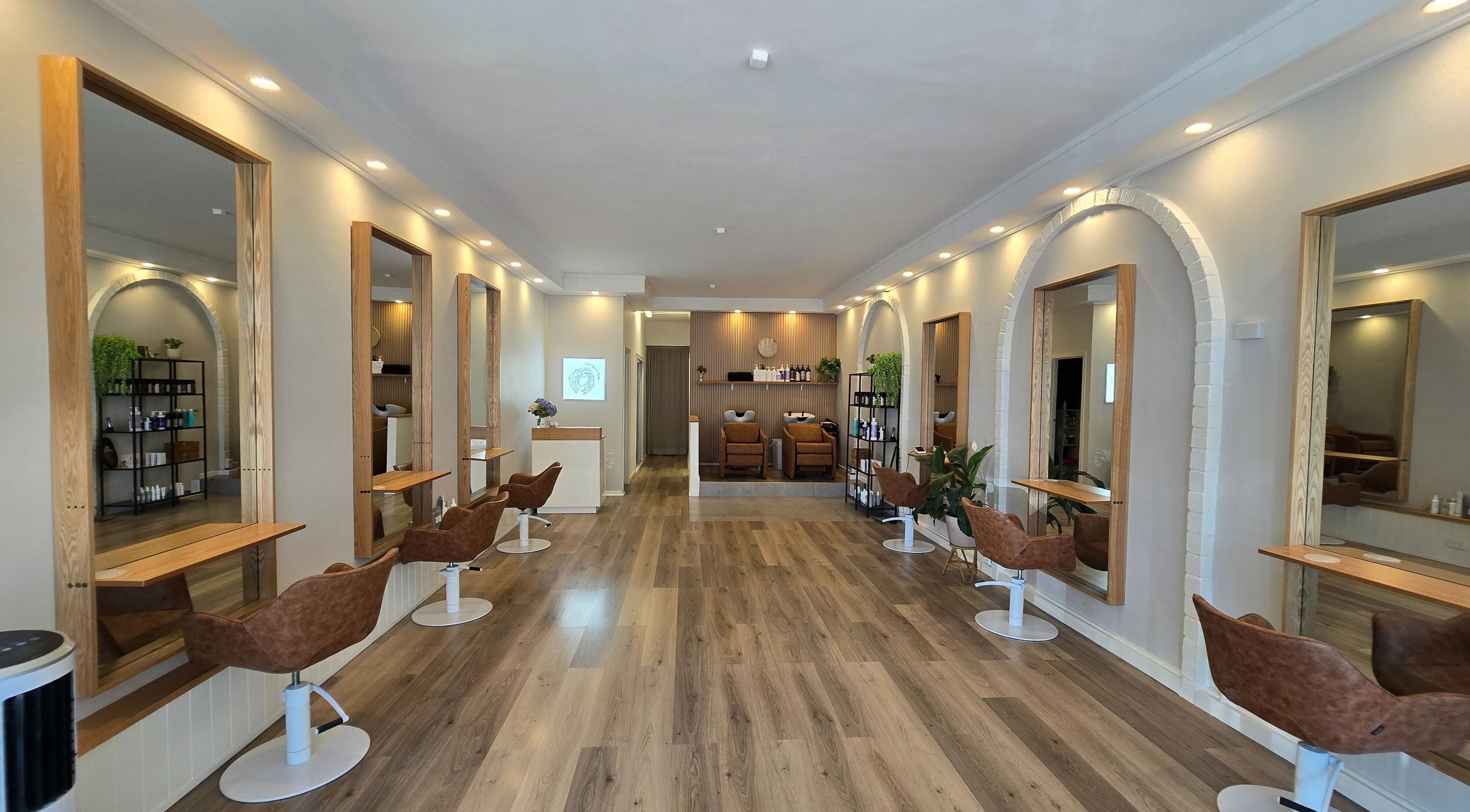 Stylish interior of Lokk Mechanic salon in Melbourne, Victoria, AU with modern chairs and mirrors.