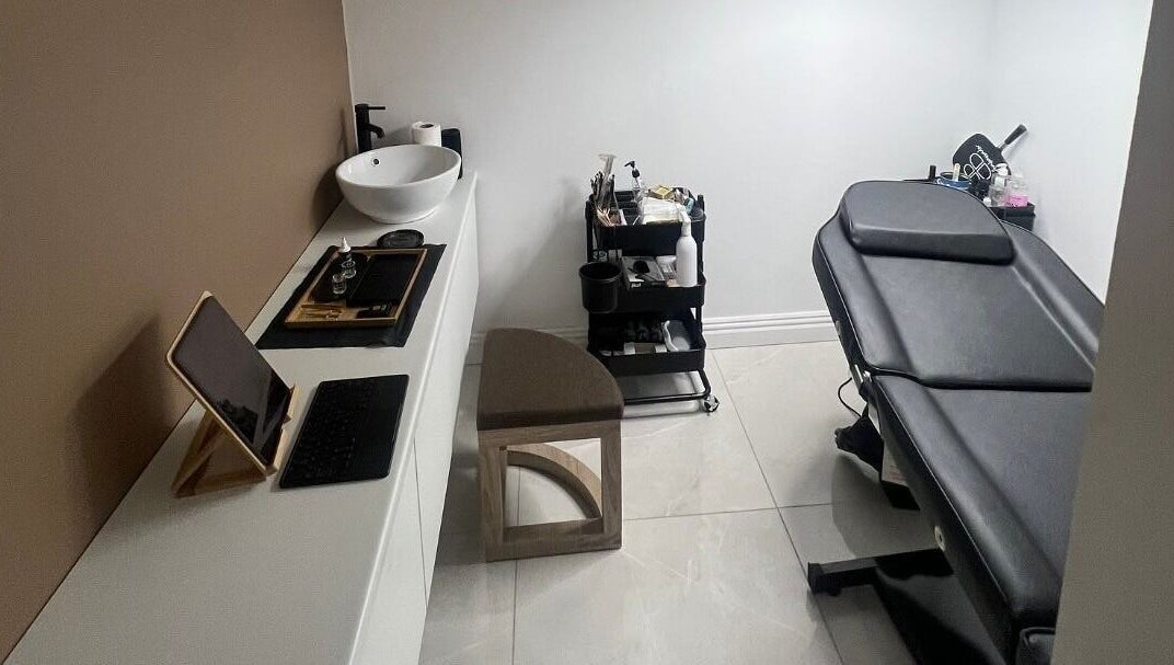 Modern treatment room at AURA THE CLINIC, Newcastle upon Tyne, England, GB with sleek décor and equipment.