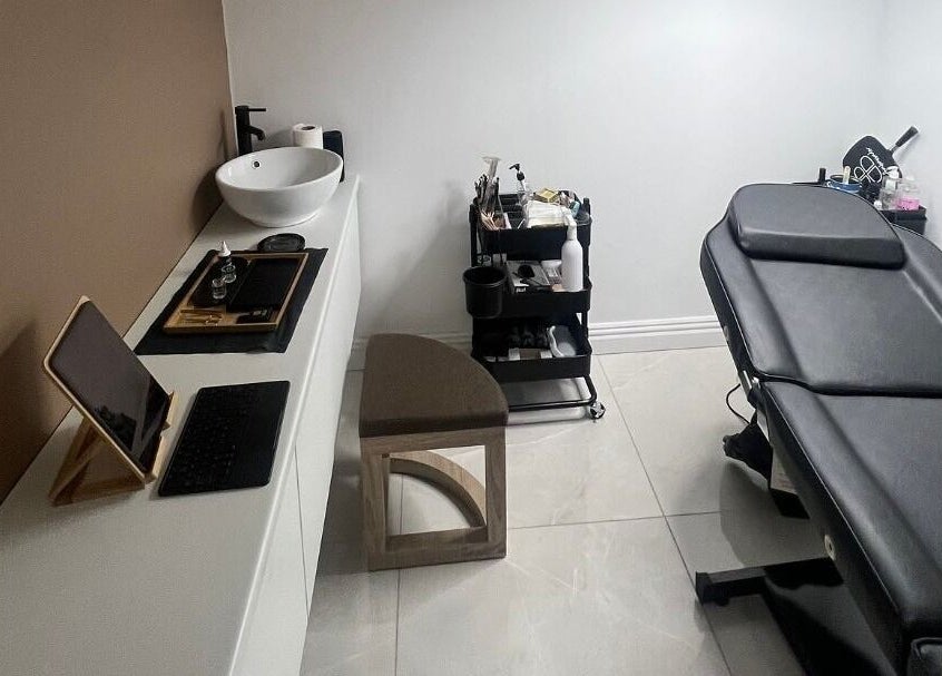 Modern treatment room at AURA THE CLINIC, Newcastle upon Tyne, England, GB with sleek décor and equipment.