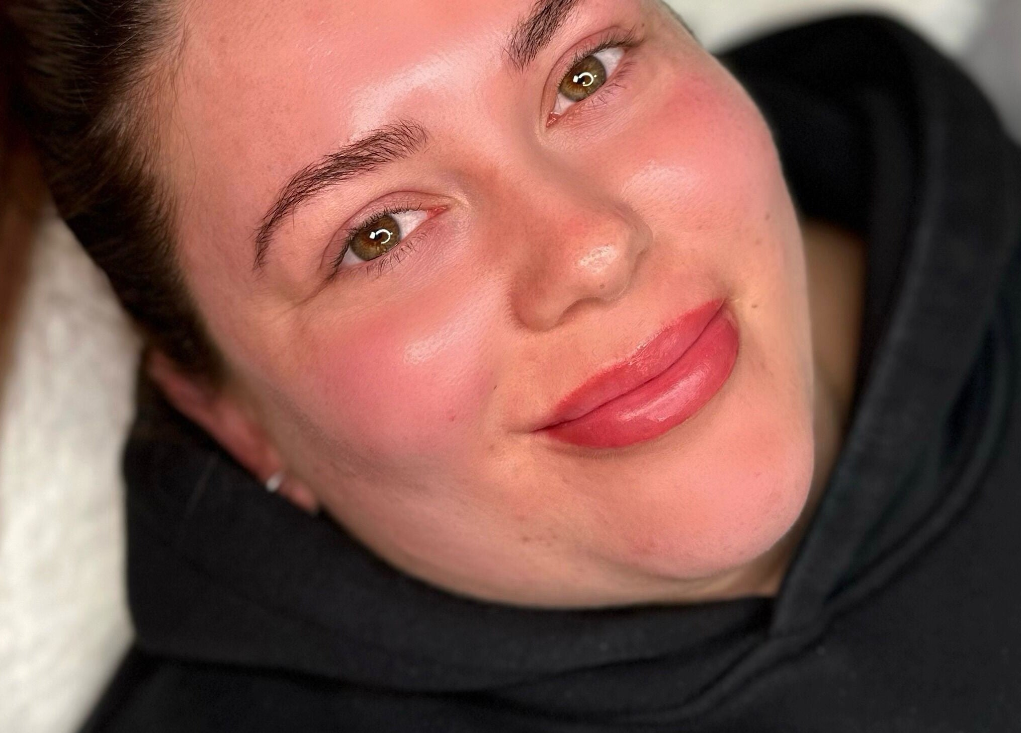 Woman with a radiant smile at AURA THE CLINIC, Newcastle upon Tyne, England, GB.