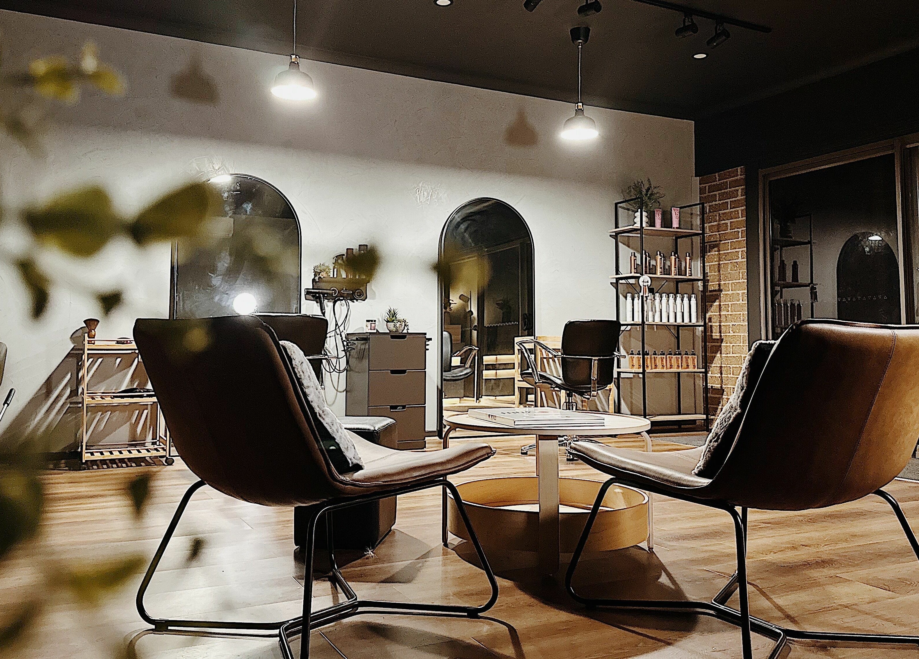 Cozy seating area at Elly’s Studio in Melbourne, Victoria, AU, featuring elegant decor and warm lighting.