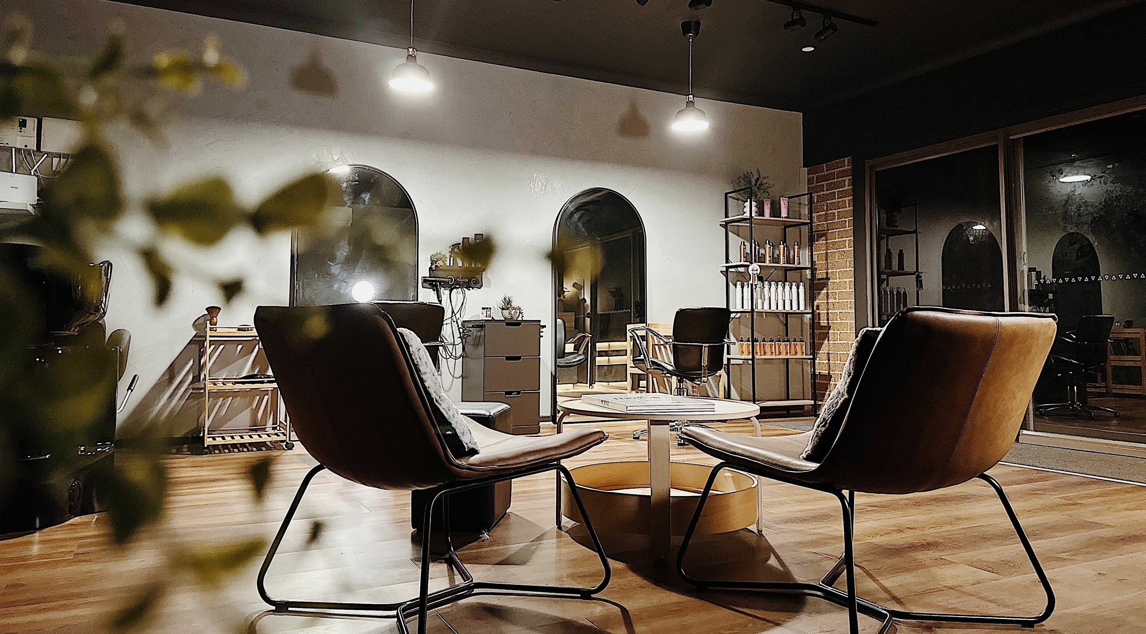 Cozy seating area at Elly’s Studio in Melbourne, Victoria, AU, featuring elegant decor and warm lighting.