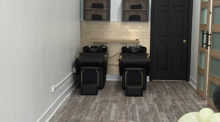 Chic hair wash stations at N’Luxe Beauty Lounge, Chicago, Illinois, US, showcasing modern interior design.