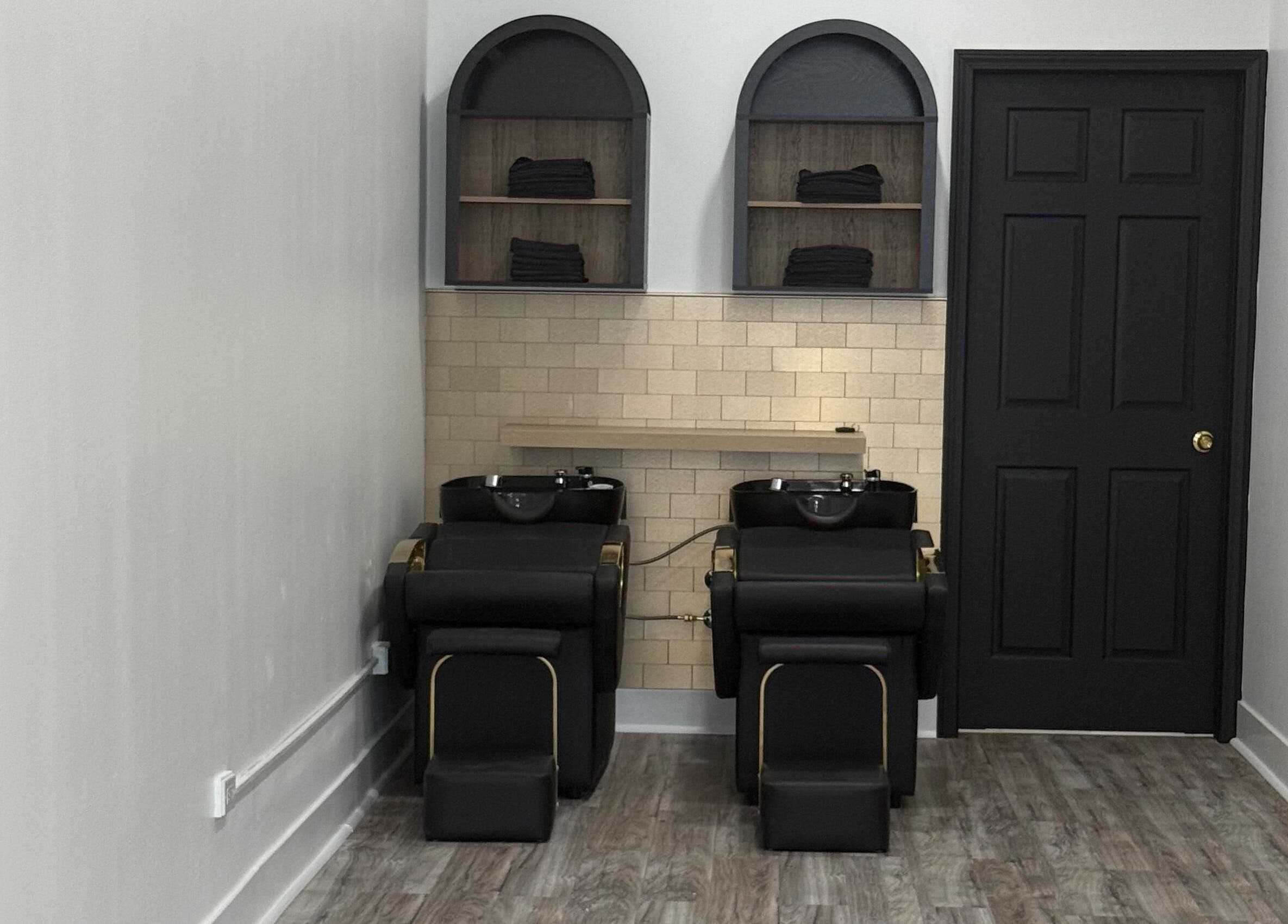 Modern wash stations at N’Luxe Beauty Lounge, Chicago, Illinois, US, providing a luxurious salon experience.