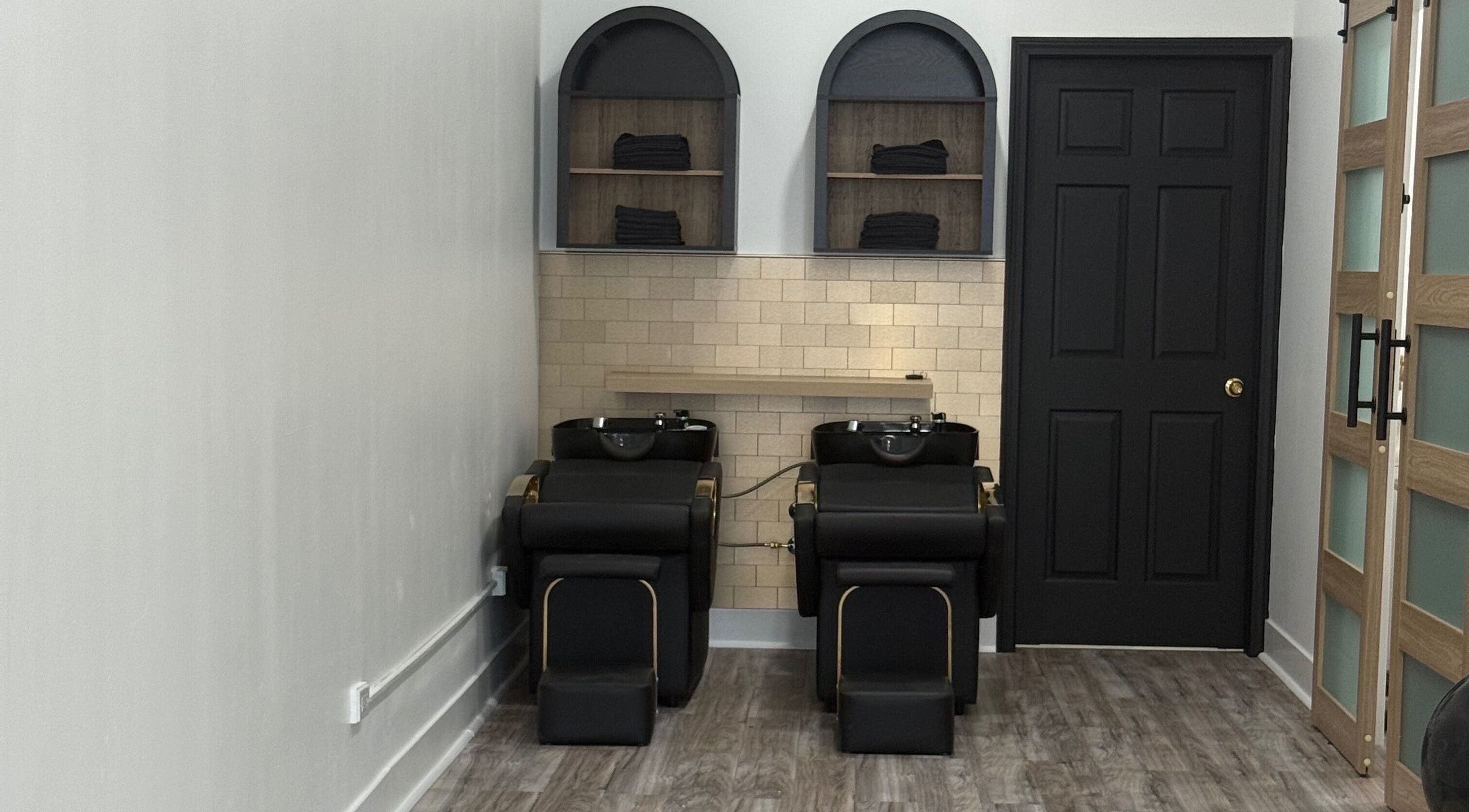 Modern wash stations at N’Luxe Beauty Lounge, Chicago, Illinois, US, providing a luxurious salon experience.