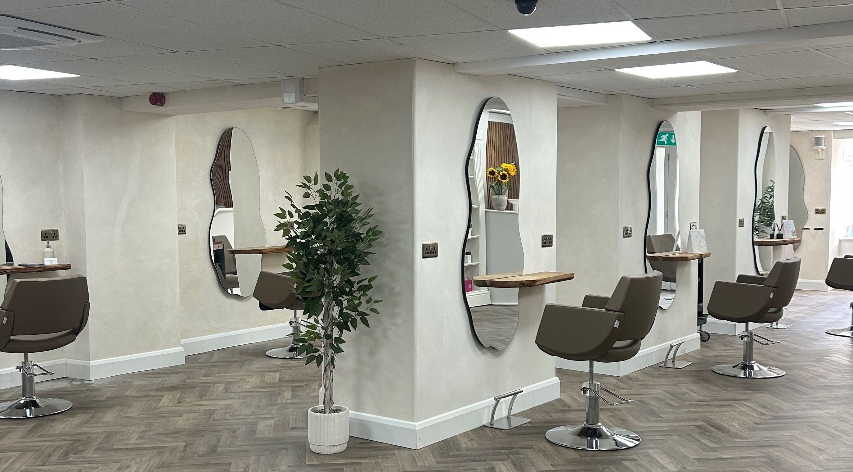 Stylish interior of Jennifer Holmes Hair and Beauty Ltd in Masham, England, GB showcasing elegant salon spaces.