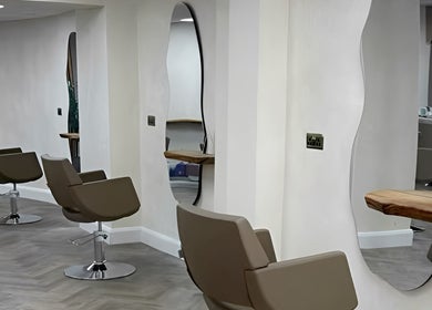 Stylish salon interior with modern mirrors at Jennifer Holmes Hair and Beauty Ltd in Masham, England, GB.