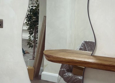 Elegant salon mirror and wooden shelf at Jennifer Holmes Hair and Beauty Ltd, Masham, England, GB.