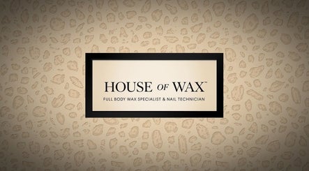 House of Wax sign in Wrexham, Wales, GB with elegant lettering and textured background.