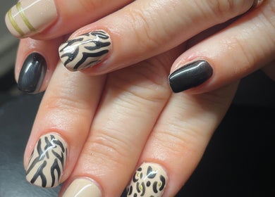 Elegant zebra pattern nail art at House of Wax, Wrexham, Wales, GB.