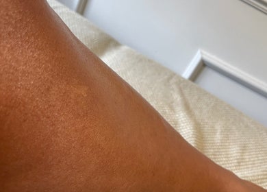 Smooth skin treatment at House of Wax, Wrexham, Wales, GB, showcasing silky, hydrated leg.