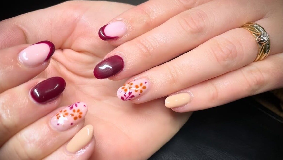 Beautiful floral nail art at House of Wax, Wrexham, Wales, GB, showcasing intricate designs and vibrant colors.
