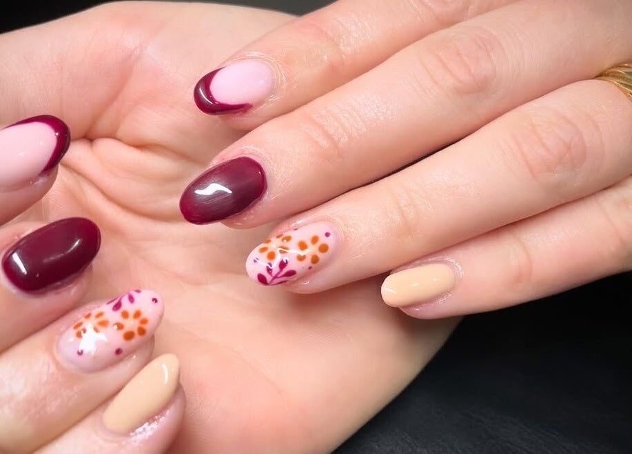 Beautiful floral nail art at House of Wax, Wrexham, Wales, GB, showcasing intricate designs and vibrant colors.
