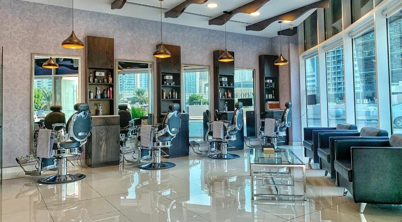 Luxurious interior of Black Tie Salon - Gent’s Spa and Barbershop in Dubai, Dubai, AE, featuring modern barber chairs.