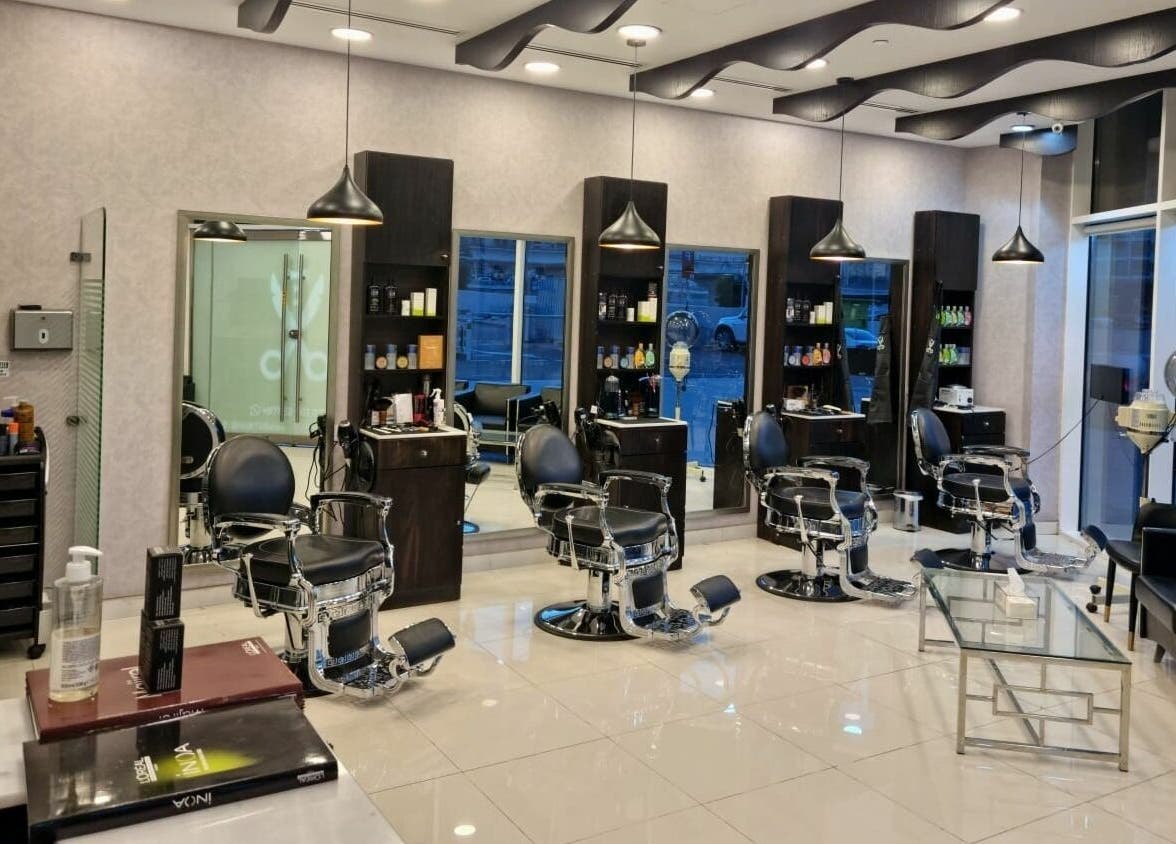 Interior of Black Tie Salon - Gent’s Spa and Barbershop, Dubai, Dubai, AE featuring modern barber chairs.
