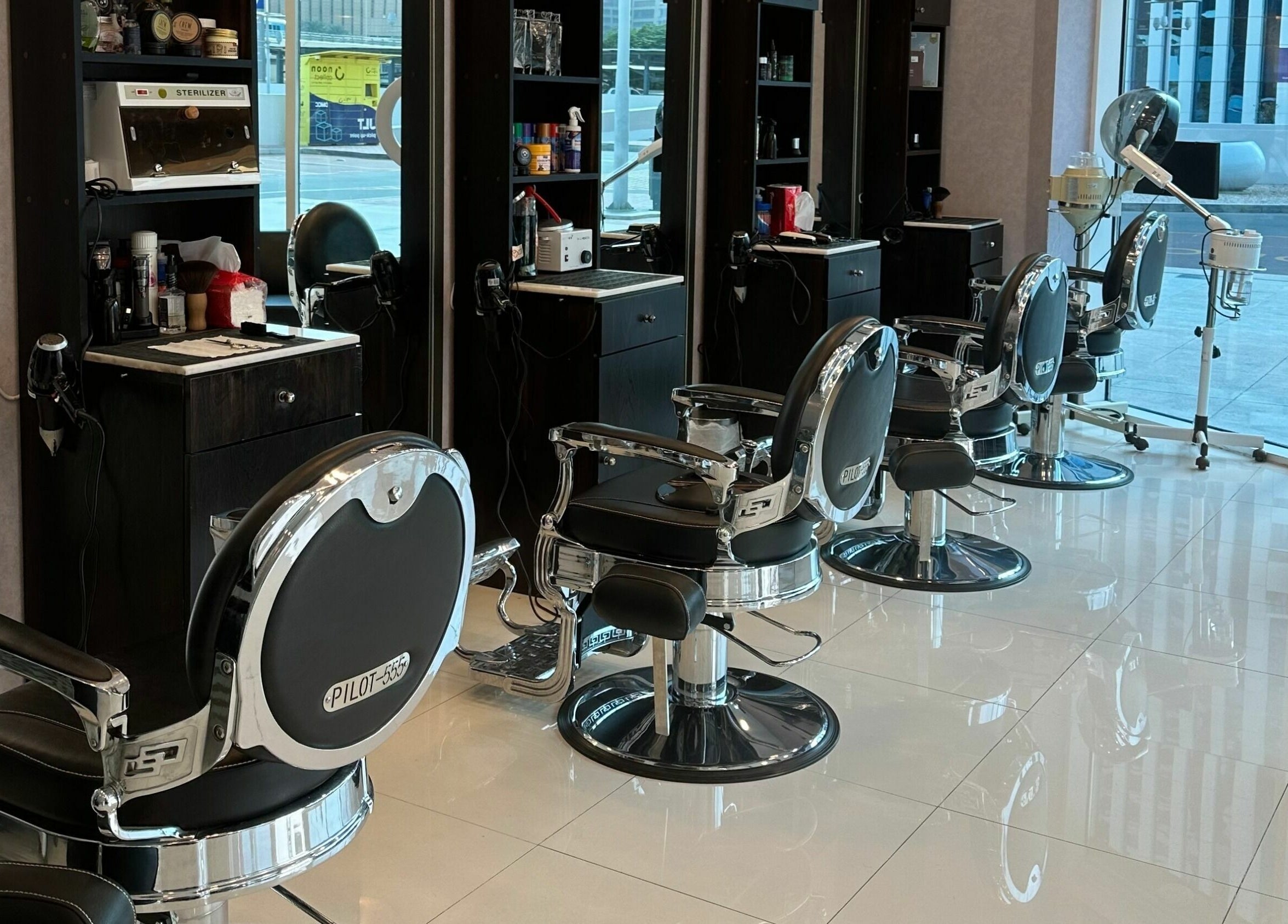 Modern barber chairs at Black Tie Salon - Gent’s Spa and Barbershop, Dubai, Dubai, AE.
