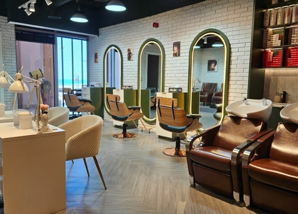 Modern interior of Peaky Blinders | The Palm in Dubai, AE, featuring stylish salon chairs and mirrors.