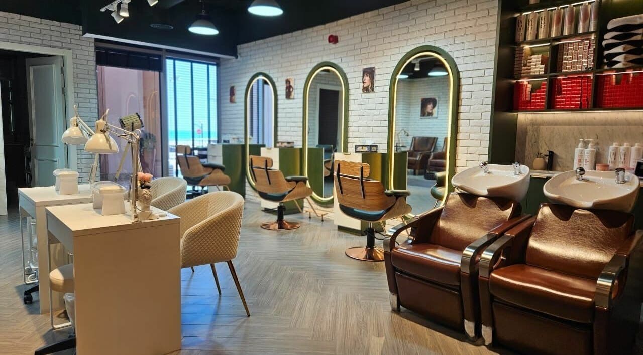 Modern interior of Peaky Blinders | The Palm in Dubai, AE, featuring stylish salon chairs and mirrors.