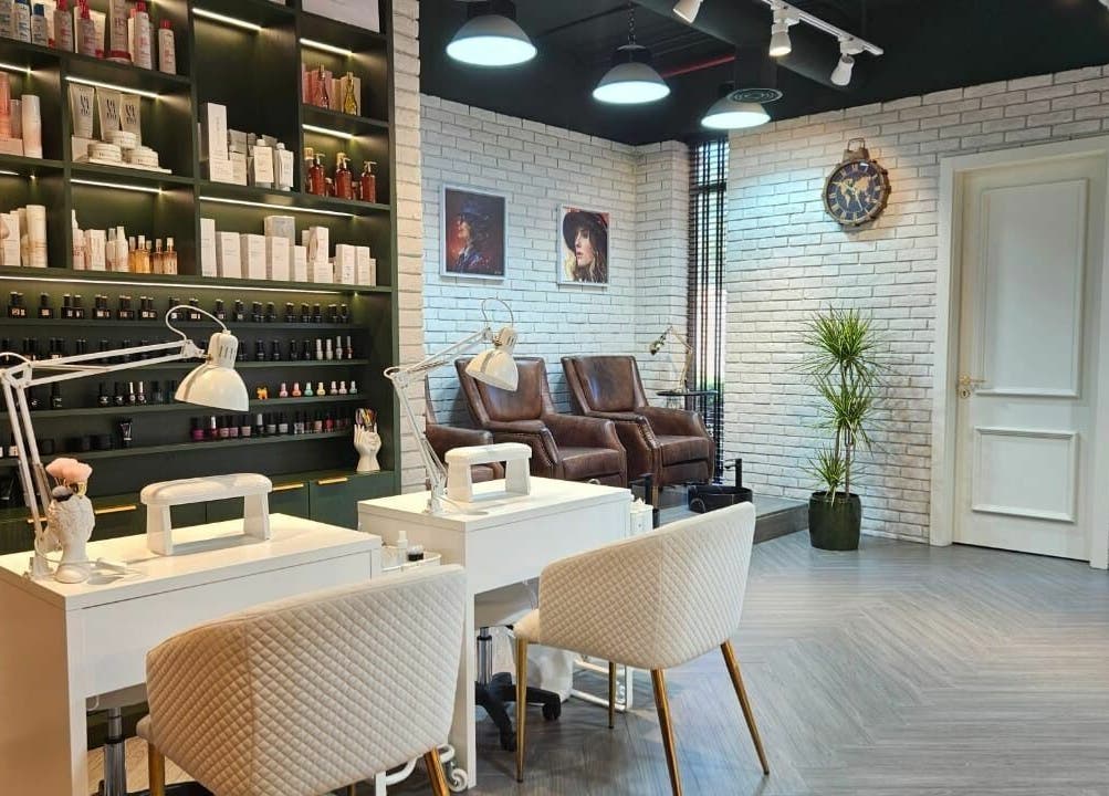Stylish nail salon at Peaky Blinders | The Palm, Dubai, AE with modern decor and plush seating.