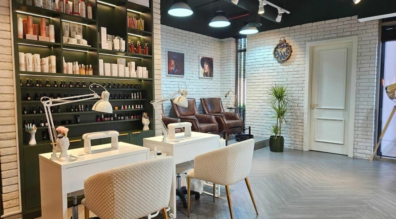 Stylish nail salon at Peaky Blinders | The Palm, Dubai, AE with modern decor and plush seating.