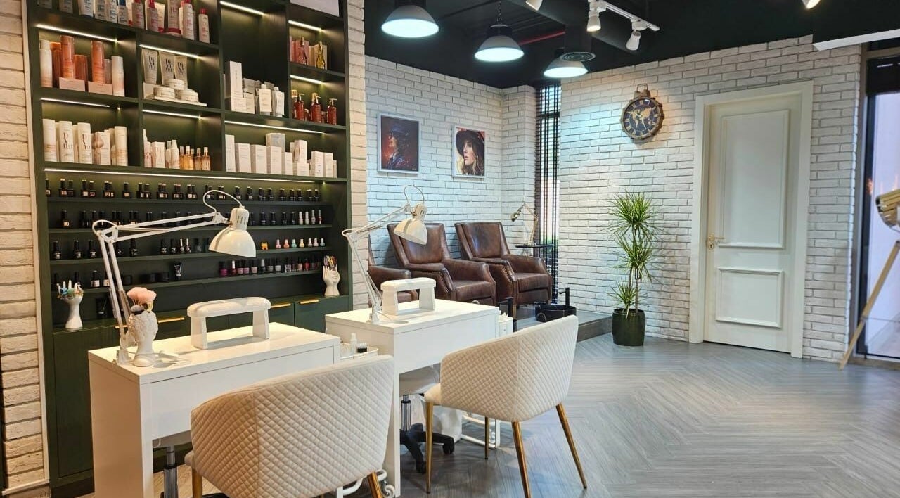 Stylish nail salon at Peaky Blinders | The Palm, Dubai, AE with modern decor and plush seating.