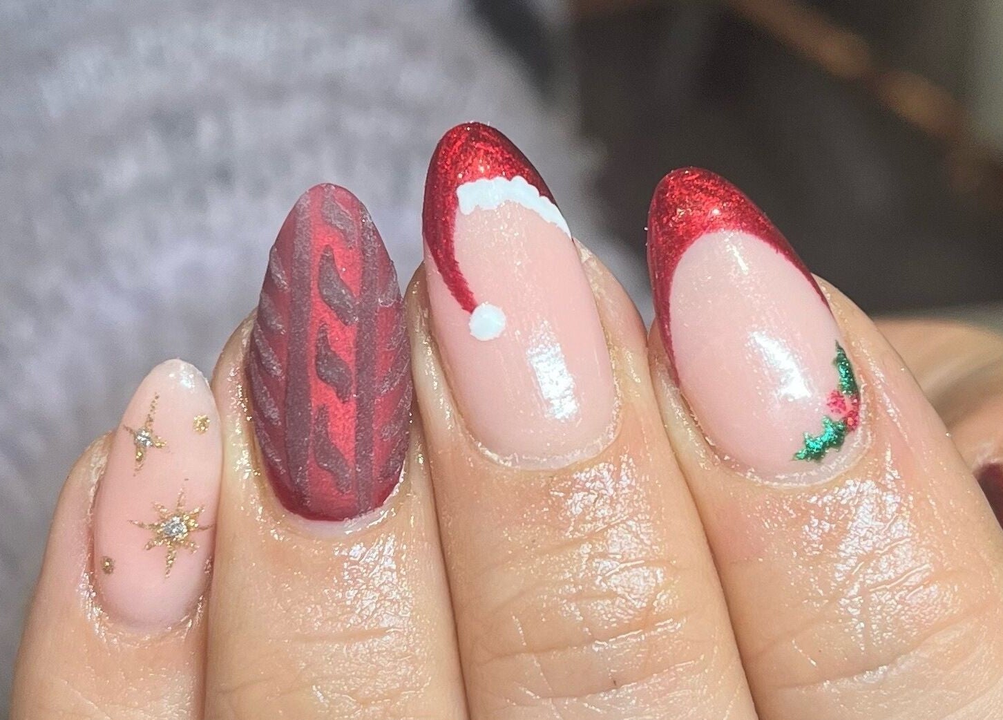 Festive red holiday-themed nail art at DS Beauty Salon, Banchory, Scotland, GB.