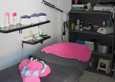 Intimate treatment room at ZiaLise Beauty Bar, Boksburg, Gauteng, ZA, featuring pink accents and skincare tools.