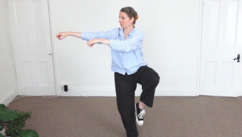 Instructor demonstrates Tai Chi posture at Earth Balance Tai Chi, Via Zoom / MsTeams, England, GB.