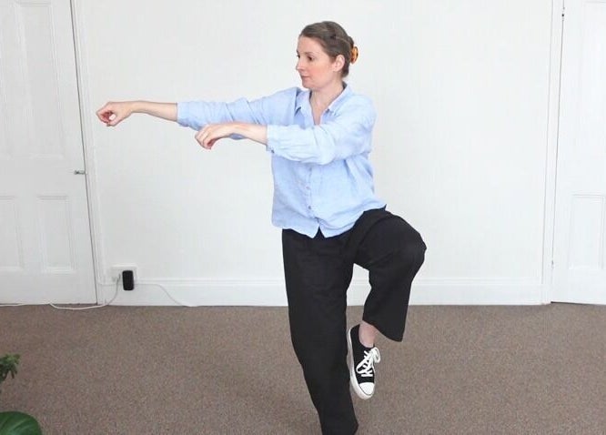 Instructor demonstrates Tai Chi posture at Earth Balance Tai Chi, Via Zoom / MsTeams, England, GB.