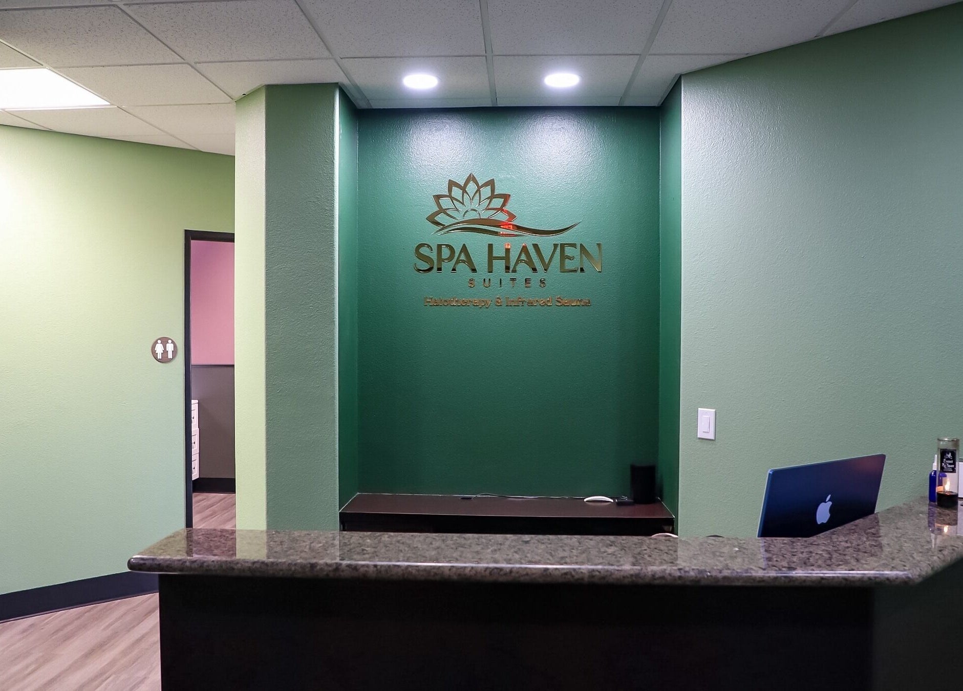 Reception area at Spa Haven Suites, Henderson, Nevada, US featuring a sleek front desk and inviting atmosphere.