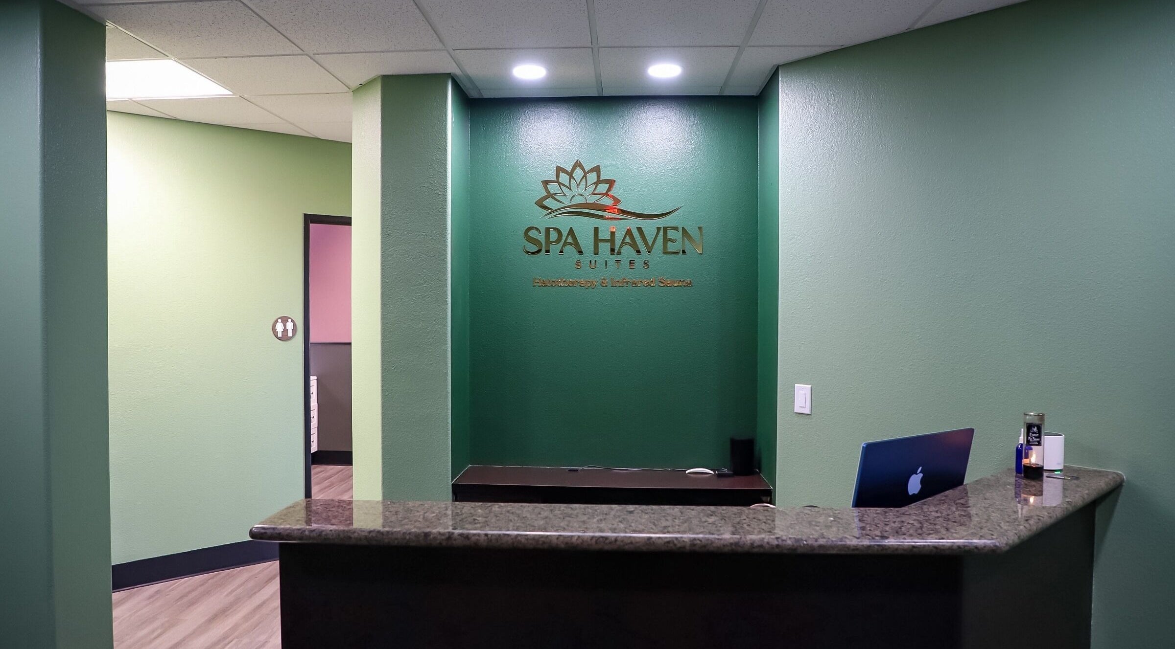 Reception area at Spa Haven Suites, Henderson, Nevada, US featuring a sleek front desk and inviting atmosphere.