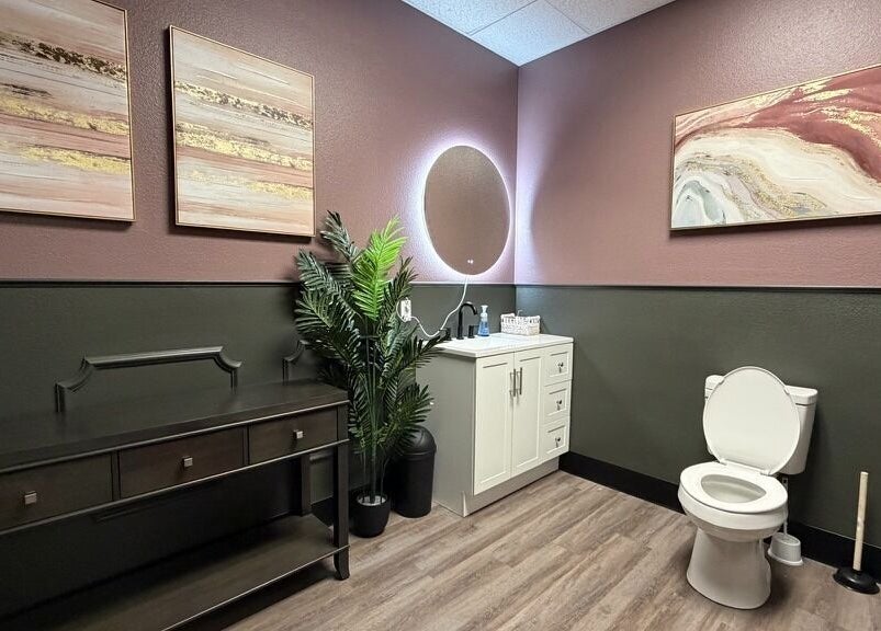Elegant restroom at Spa Haven Suites, Henderson, Nevada, US with modern decor and abstract art.